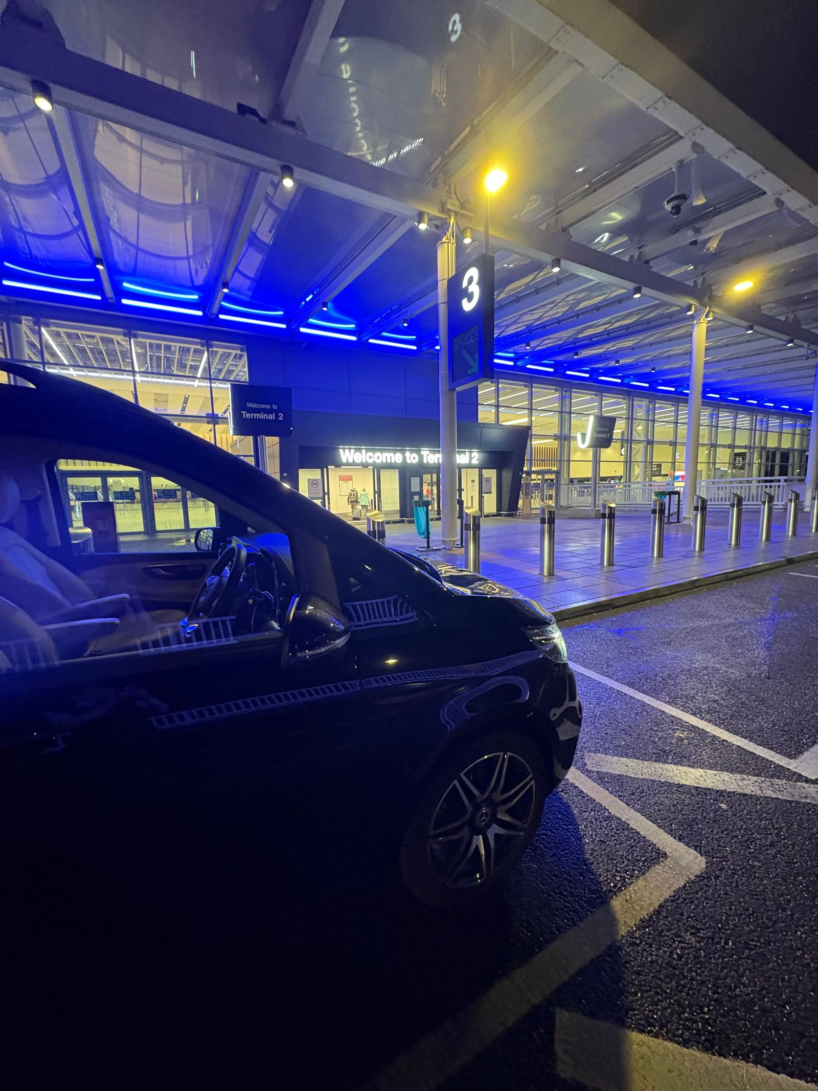 AO Platinum Chauffeurs Mercedes-Benz V-Class at Manchester Airport Terminal 2 at night